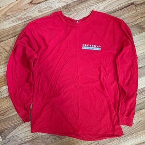 Large, red, long sleeve Brooklyn Stages promo shirt.